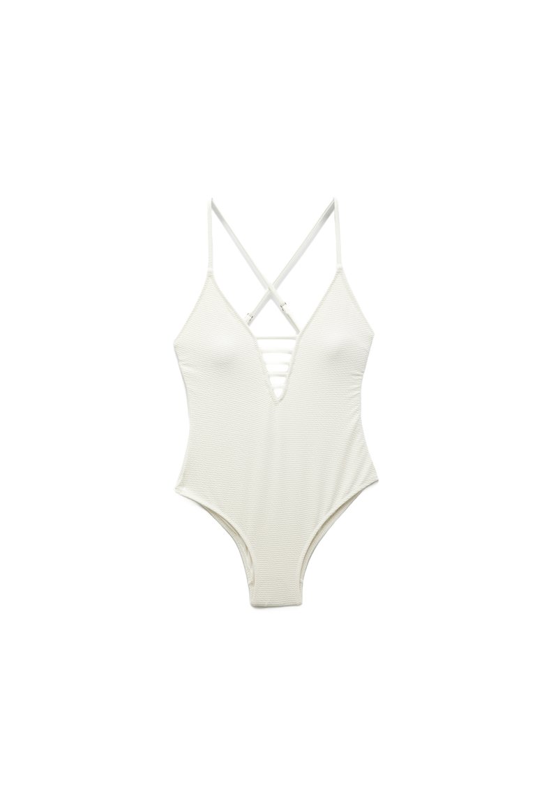 Maillot de bain une pièce blanc avec des bretelles croisées, décolleté en V profond, texture côtelée et jambes échancrées. Présente un détail à lacet à l'avant.