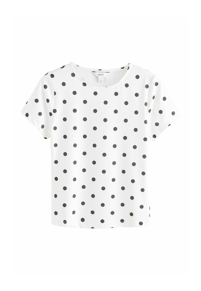 Vit kortärmad t-shirt med svarta prickar, rund halsringning, mjukt tyg och avslappnad passform. Har inga ytterligare detaljer eller mönster.