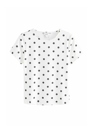 White short-sleeve t-shirt with black polka dots, round neckline, soft fabric, and a relaxed fit. Domes not feature additional accents or patterns.
