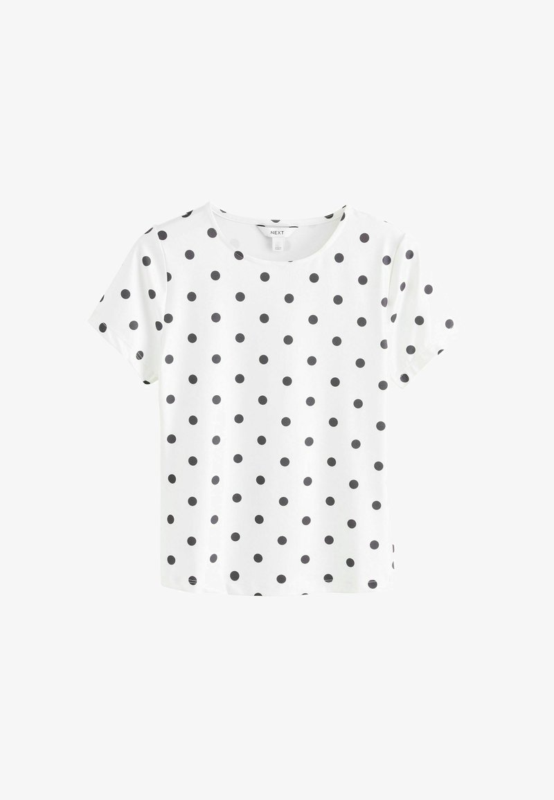 T-shirt bianco a maniche corte con pois neri, scollatura rotonda, tessuto morbido e vestibilità rilassata. Non presenta ulteriori dettagli o fantasie.