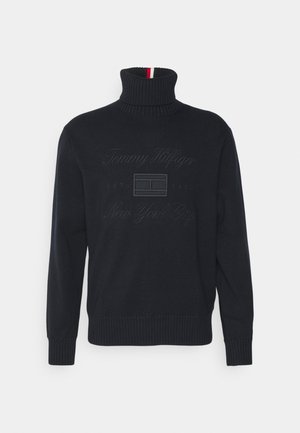 Marinefarbener Rollkragenpullover aus Strickstoff mit gerippten Bündchen und Saum. Besticktes "Tommy Hilfiger" und "New York City" auf der Vorderseite.
