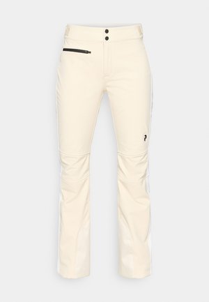 Bežid suusipüksid, mis on valmistatud pehmest ja venivast kangast. Omab lukuga taskut, kahte nuppu vööl ja kontrastseid külgpaneele.