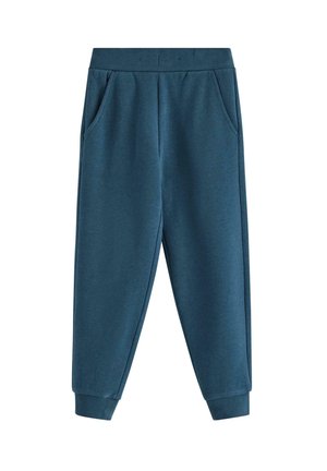 Pantaloni jogger color turchese realizzati in tessuto morbido, dotati di due tasche laterali, vita elastica e polsini affusolati alla caviglia. Texture liscia.