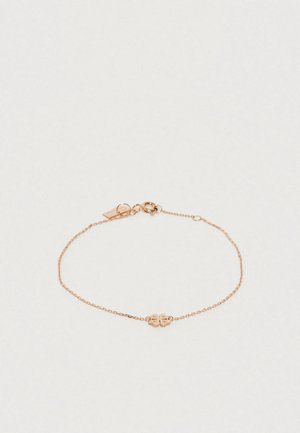 Rožu zelta rokassprādze ar plānu ķēdi un zieda formas centrālo daļu, kas raksturo iegravētu detaļu un omā saiti.