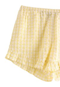 Gule gingham shorts med elastisk talje, der har en rynket nederkant og et blødt, tekstureret stof med skiftende lyse og mørke striber.