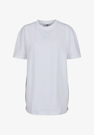 T-shirt blanc à manches courtes en coton, avec un col rond et une coupe décontractée, sans motifs ni graphismes visibles.