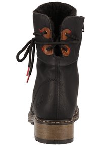 Black leather ankle boot with a faux fur lining, brown eyelets, red laces, and a wooden-style heel. Features stitching detail on the sides.