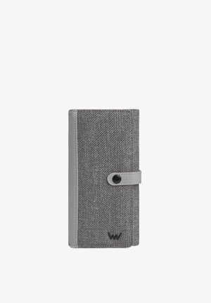 Gray textile wallet with a smooth gray leather accent, button closure, and embossed logo. Textured fabric surface with minimalistic design.