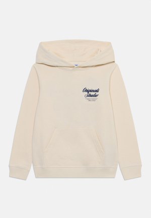 Sweat à capuche beige avec poche avant et inscription "Originals Studio" bleu marine sur la poitrine gauche, manches longues et poignets côtelés.