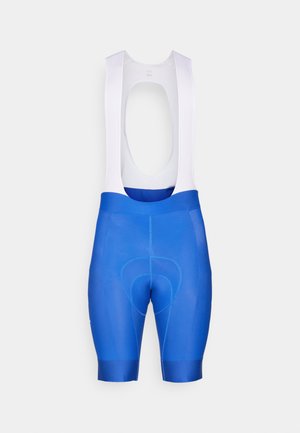 Bermudas de cyclisme bleues avec des bretelles blanches, dotées d'un siège rembourré, d'une texture lisse et d'une coupe ajustée pour le confort et la performance.