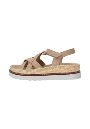 Beige leather sandal with crossed straps, adjustable back, and woven jute platform. White rubber sole with textured grip.