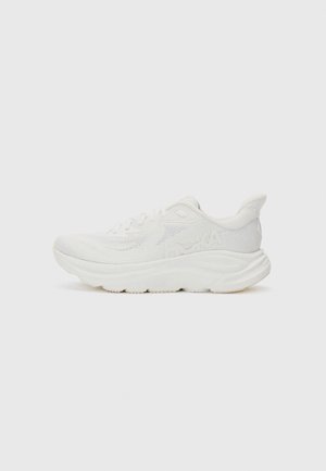 White running shoe with a textured mesh upper, padded collar, thick midsole, and rubber outsole. Features logo detail on the side.