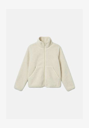 Fløyelsjakke i kremfarge med hel frontglidelås, høy krage, lange ermer og to framlommer, lagt flatt på hvit bakgrunn.
