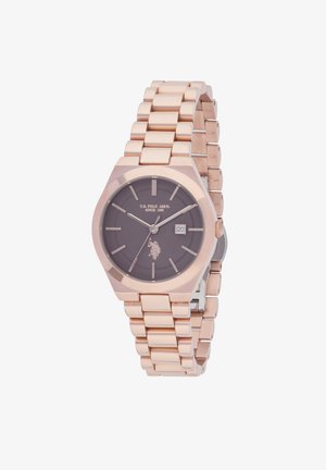 Orologio in oro rosa con cassa esagonale, quadrante grigio scuro, indicatori delle ore argentati e visualizzazione della data. Bracciale a maglia metallica con finitura lucida.