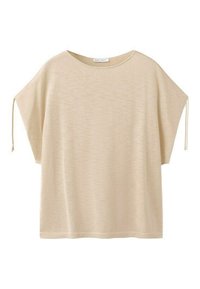 Haut en maille beige à manches courtes avec des manches larges et amples dotées de liens à nouer aux extrémités et un col rond.