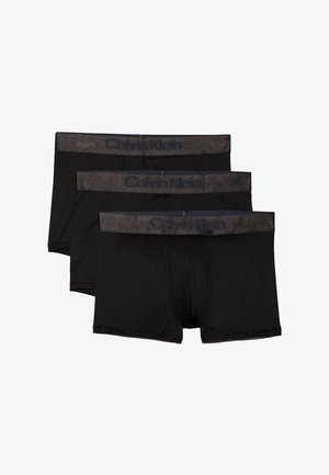 Boxer da uomo neri in cotone, in confezione da tre. Presentano un elastico grigio in vita con il logo "Calvin Klein". Texture liscia, design aderente.