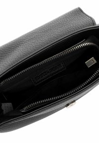 Black leather bag with a textured surface, zip closure, and silver hardware. Interior features fabric lining with a brand label.