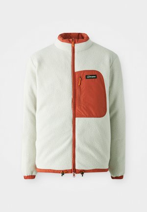 Veste en polaire blanche avec une fermeture éclair orange et une poche poitrine. Dispose d'un col haut, de poignets élastiques et d'un cordon de serrage à l'ourlet.
