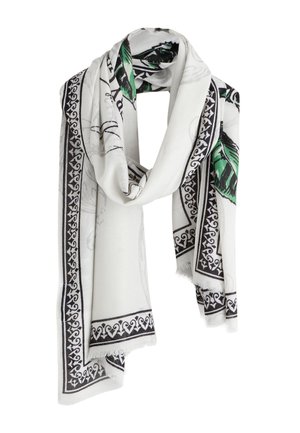 Biały szal z czarną ozdobną bordiurą i zielonymi wzorami liści, luźno ułożony z miękkiego materiału z frędzlami na brzegach.