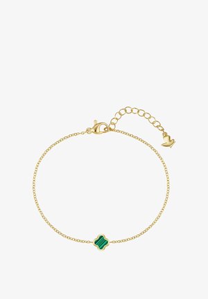 Jemný náramok zo zlatého reťazca s malým zeleným malachitovým príveskom v tvare štvorlístka a nastaviteľnou karabínkou s predlžovacím reťazcom.