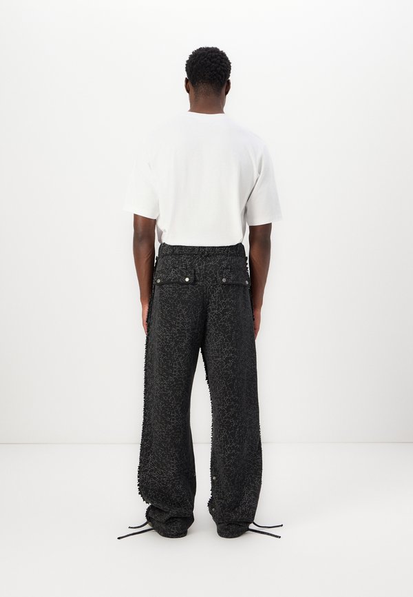 FLAWED PANTS UNISEX - Tracksuit bottoms3