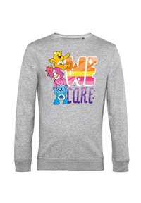 Felpa grigia con colorati orsacchiotti dei cartoni animati impilati l'uno sull'altro, con la scritta "WE CARE" in lettere grassetto e vivaci.