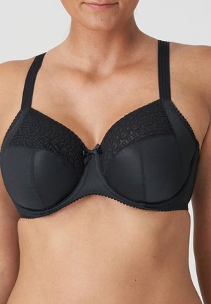 Black bra with underwire, lace detailing at the top, adjustable straps, and a small bow accent at the center. Smooth texture overall.