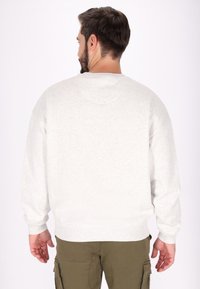 Grijze sweatshirt met een ontspannen pasvorm, ribbelde mouwen en zoom. Gemaakt van een katoenmix met een zachte textuur. Heeft een ronde halslijn en geen zichtbare graphics.