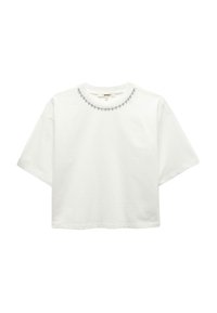 Hvid cropped t-shirt lavet af bomuld, med en rund halsudskæring pyntet med små dekorative perler langs kraven. Korte ærmer.