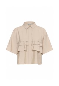 Beige short-sleeve shirt with a button-up front, featuring two horizontal ruffles across the chest and a soft, smooth texture.