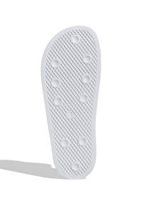 Vit gummisko inlägg med texturerad yta, hexagonalt mönster och sex runda ventilationshål. Storlek markerad '9.'