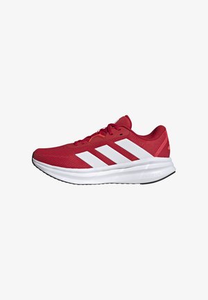 Red athletic shoe with mesh upper, white three-stripe design, padded collar, and Cloudfoam sole. Features black outsole for traction.