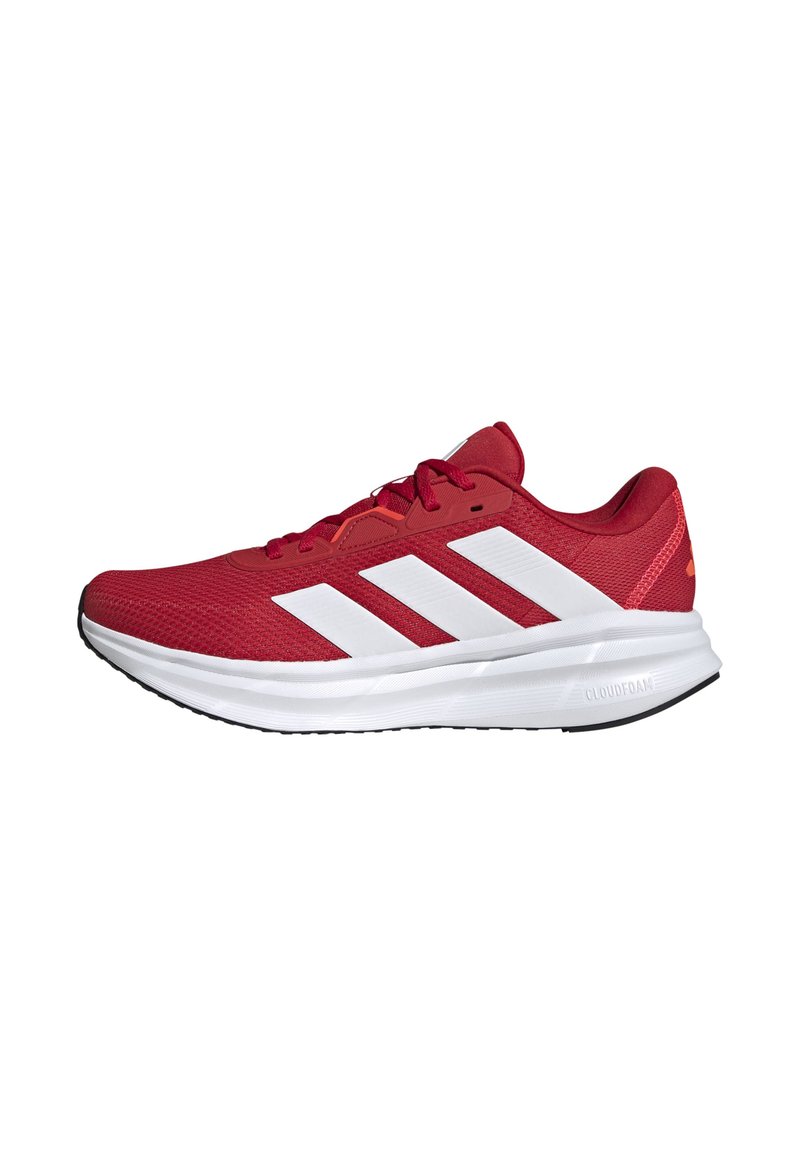 Red athletic shoe with mesh upper, white three-stripe design, padded collar, and Cloudfoam sole. Features black outsole for traction.