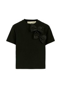 Zwarte T-shirt met korte mouwen en ronde hals, versierd met twee grote zwarte stoffen strikken aan de bovenlinkerzijde.