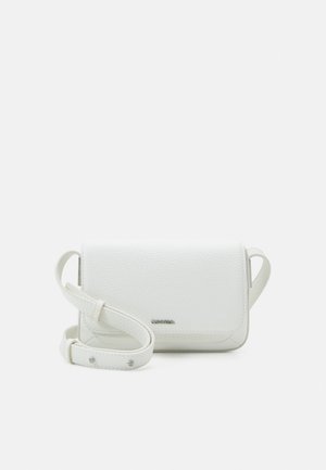 White textured leather crossbody bag with adjustable strap and small metal brand logo on front flap.