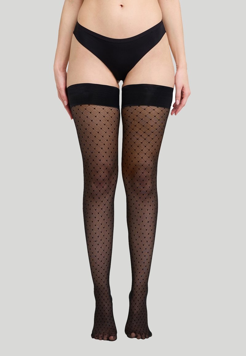 Calze autoreggenti in rete nera con un motivo a diamante e morbidi elastici in silicone nella parte superiore. Design open-toe, texture trasparente.