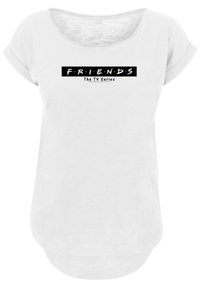 Hvit t-skjorte med korte ermer laget av myk tekstur, med et svart grafisk trykk av "F.R.I.E.N.D.S" og "TV-serien" i fet skrift.