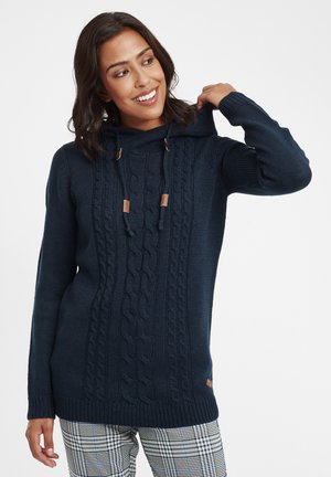 Hoodie en tricot bleu marine avec un motif en jersey torsadé, doté de cordons et d'accents en cuir. Manches longues et coupe décontractée.