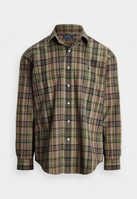 Flerfärgad rutig skjorta i tyg med gröna, bruna och marinblå linjer. Långa ärmar, knapp-ner krage och logotyp på bröstet.