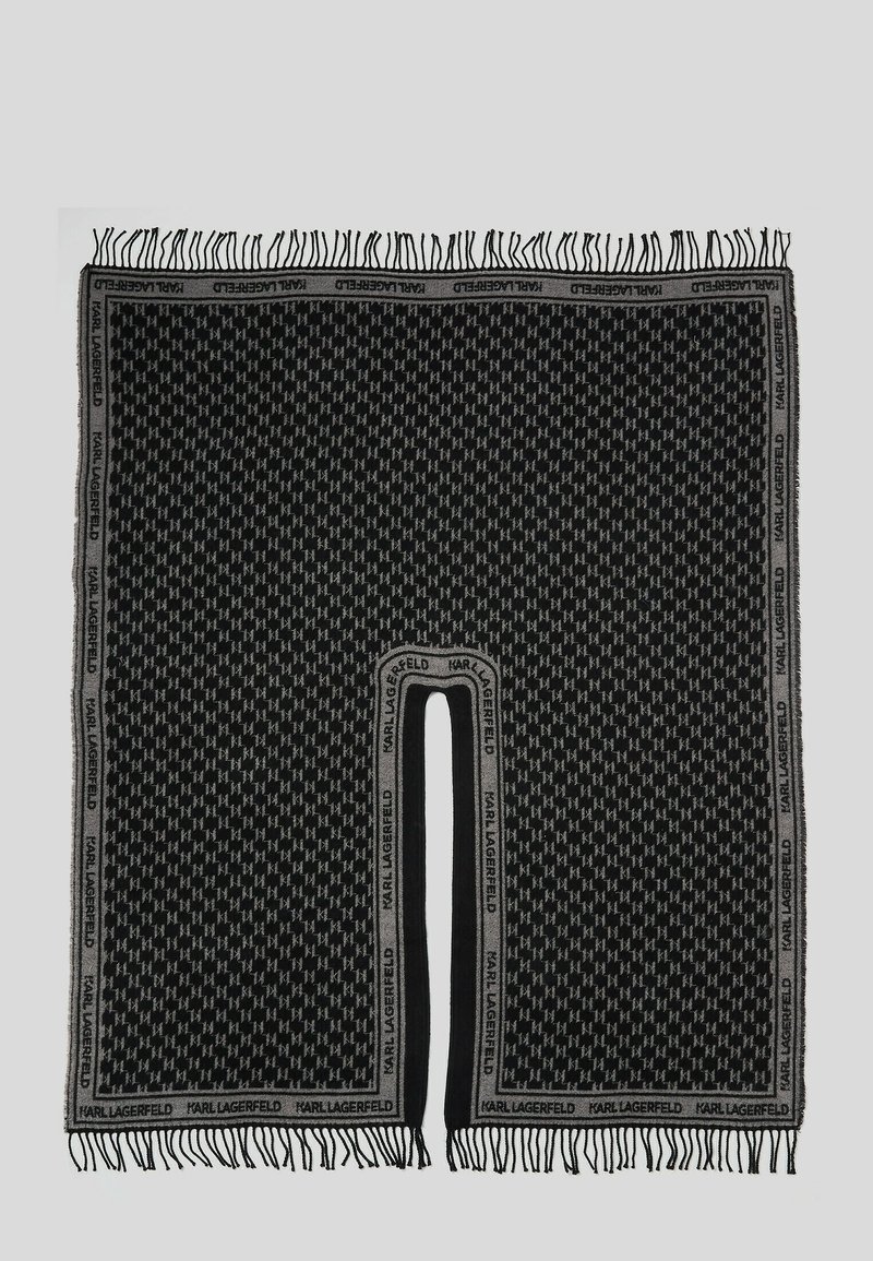 Écharpe noire et grise à motifs avec des bords à franges et une fente centrale, présentant le logo "Karl Lagerfeld" répété sur la bordure.