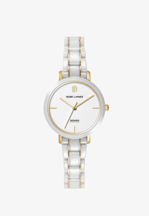 Bela in zlata keramična ročna ura z okroglim številčnico, zlatimi kazalci, minimalnimi označevalci ur in zapestnim trakom iz členkov.