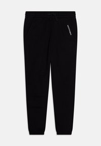 Zwarte joggingbroek van zacht materiaal, met een elastische tailleband met trekkoord, twee zijzakken en een bedrukte logo op de linkerdij.