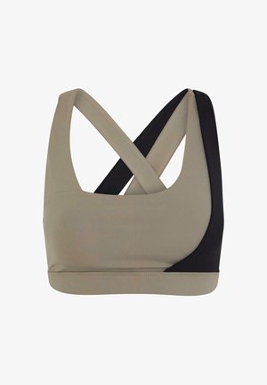 Sportovní podprsenka ve béžové a černé barvě. Obsahuje křížové ramínka, zakřivený výstřih a bezešvý design. Vyrobena z pružné, hladké tkaniny.