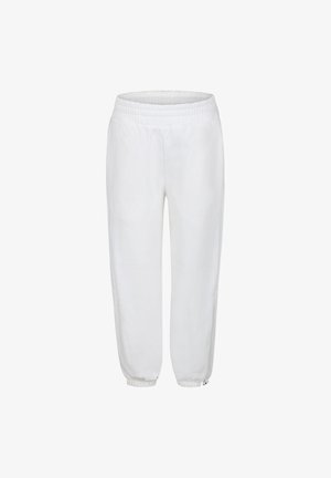 Pantalon de survêtement blanc avec taille élastique et poignets élastiques ; texture lisse et coupe ample ; design minimaliste sans motifs ni accents visibles.