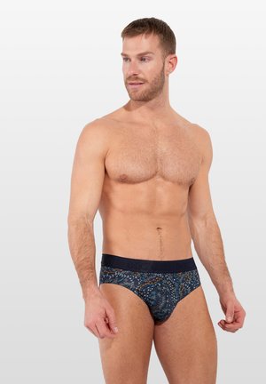 Dunkelblau gemusterte Herrenunterwäsche mit einem weichen Bund, versehen mit einem floralen Design in helleren Farben und einer engen Passform.