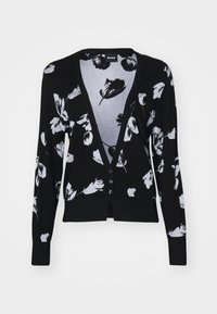 Svart cardigan med blommönster i vitt, v-ringad, knappar fram, lång ärm och med en något öppen nederkant.