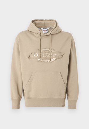 Beiger Kapuzenpullover mit Kängurutasche, verstellbarem Kapuzenzug und gesticktem "Dickies"-Logo auf der Vorderseite. Weiches Baumwollmaterial, gerippte Bündchen.