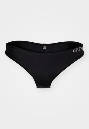 Fekete bikini alsó, sima textúrával és alacsony derékrésszel. Az elülső deréknál "GUESS" strasszkövekkel kiemelve.