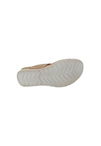 Soletta di scarpa con una superficie in gomma bianca testurizzata, caratterizzata da un motivo a zigzag e un bordo superiore beige, con una finitura liscia.