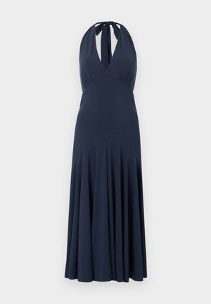 Navy blue halter-neck maxi dress with deep V-neckline, fitted waist, and flowing pleated skirt.